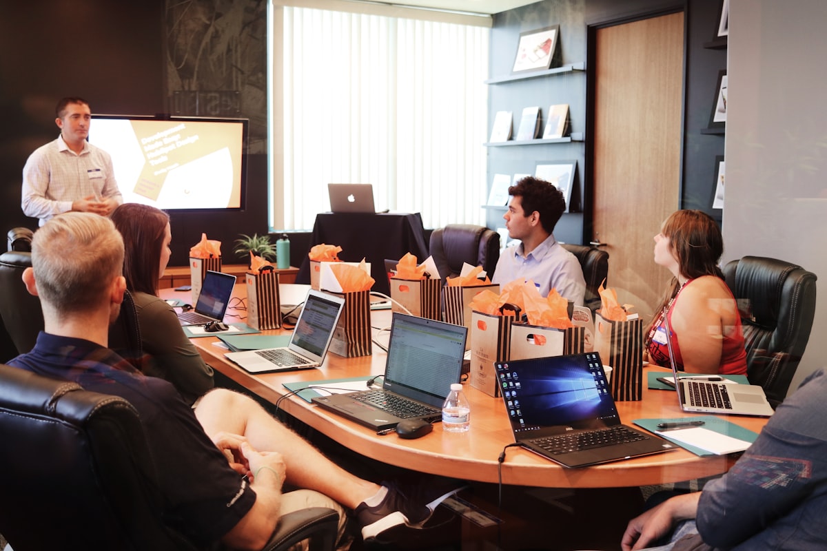 Team collaborating on workflow automation concepts during a corporate AI training session